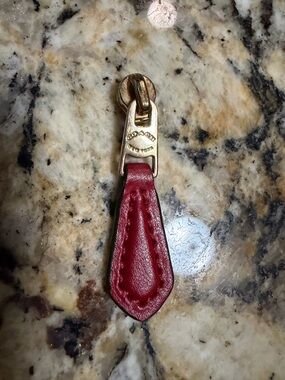 Authentic Coach Gold-Tone Zipper Pull with Red Leather Tab
